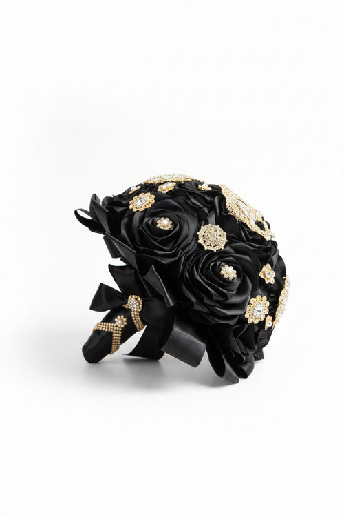 Black flower bouquet with gold accents