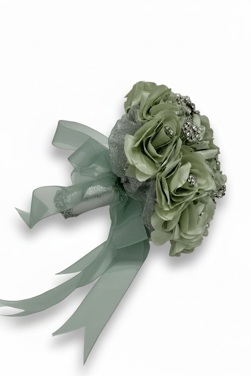 Green floral corsage with ribbons on a white background