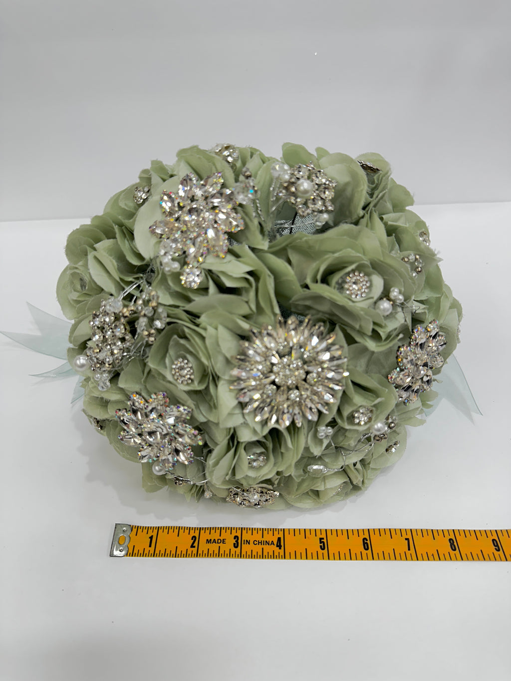 sage Green floral bouquet with silver embellishments, measured with a ruler.