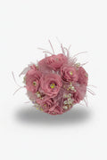 Pink flower ball with decorative elements on a white background