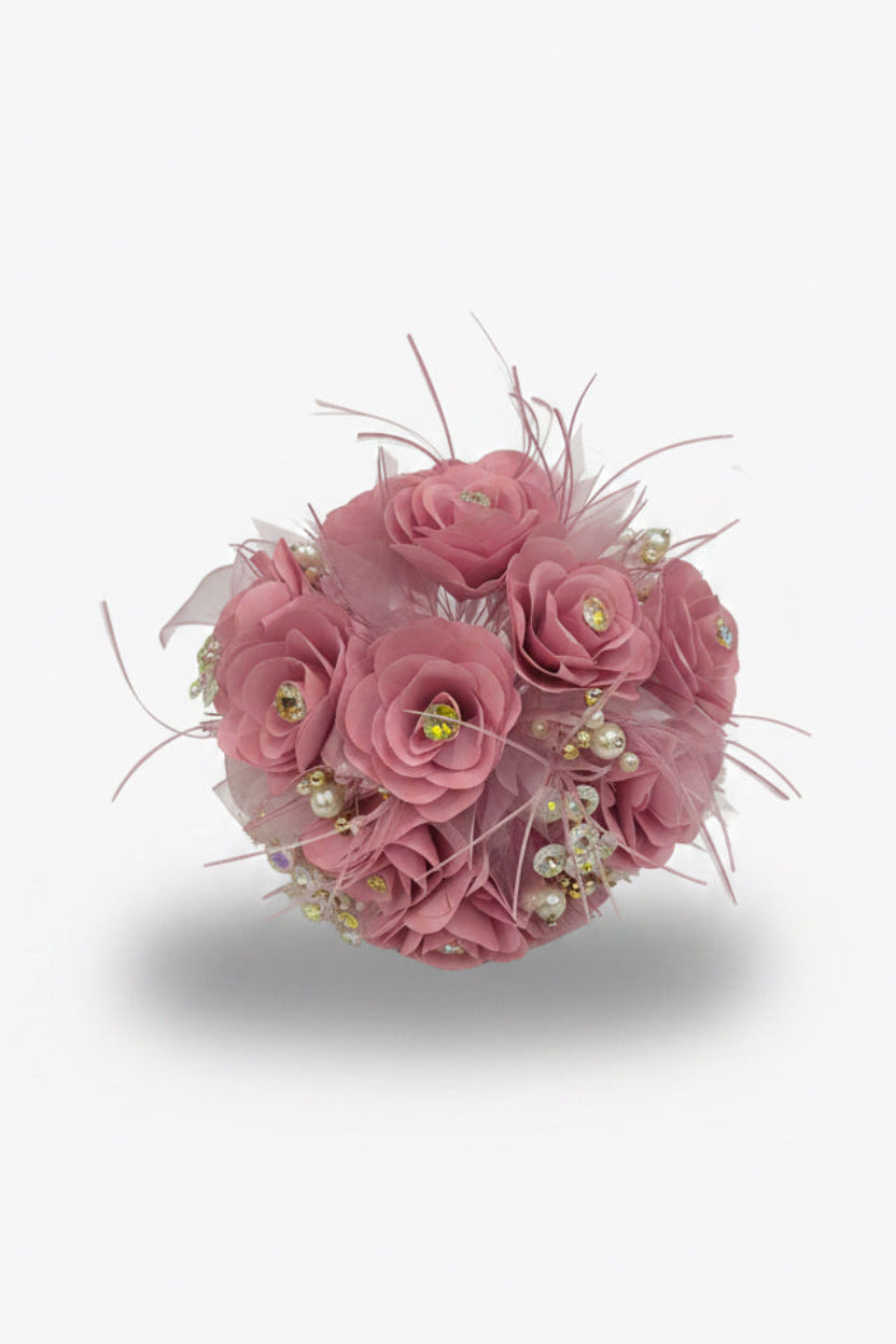 Pink flower ball with decorative elements on a white background