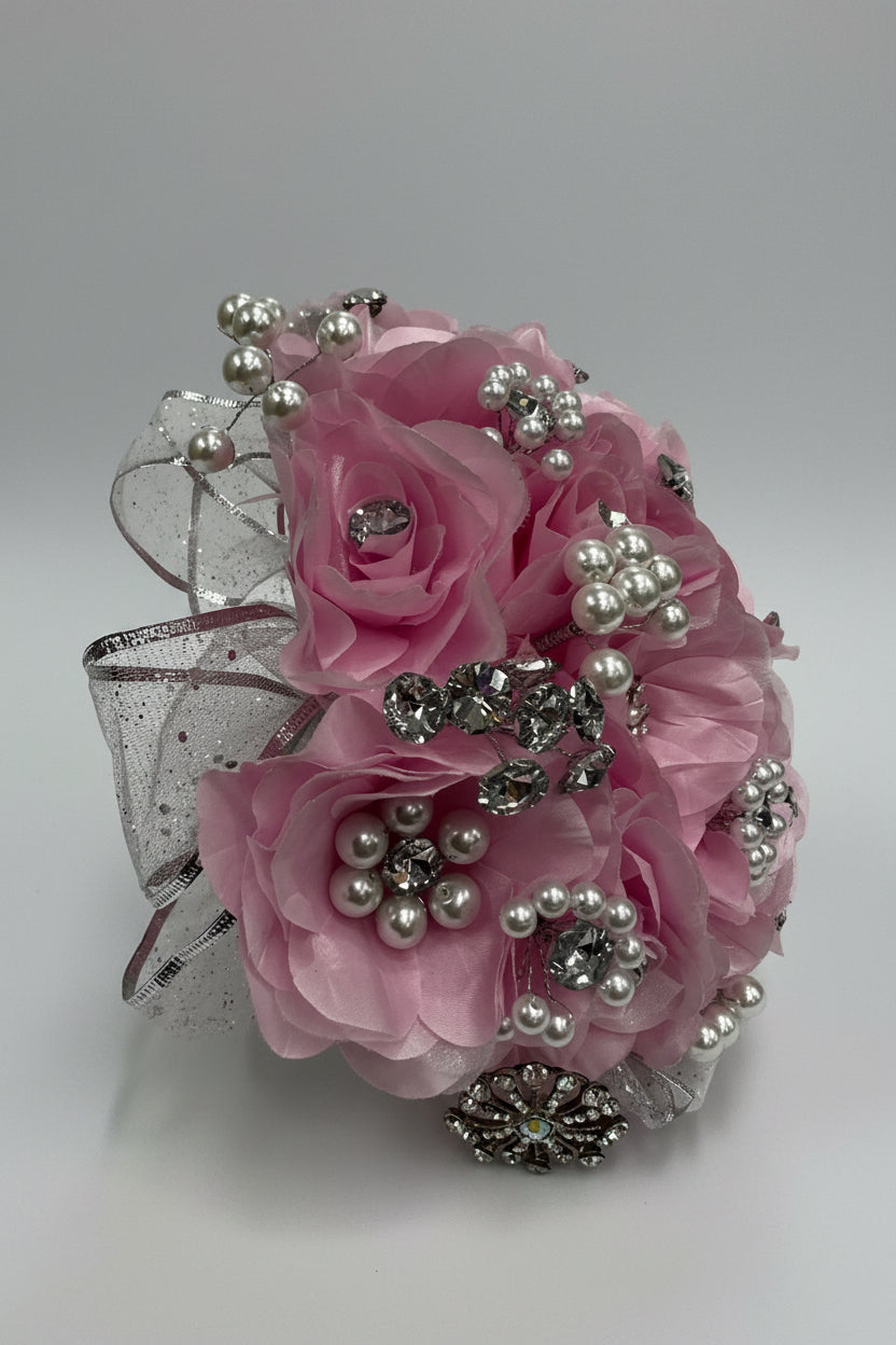 baby pink bouquet with silver embelishments and pearl beading as decoration 