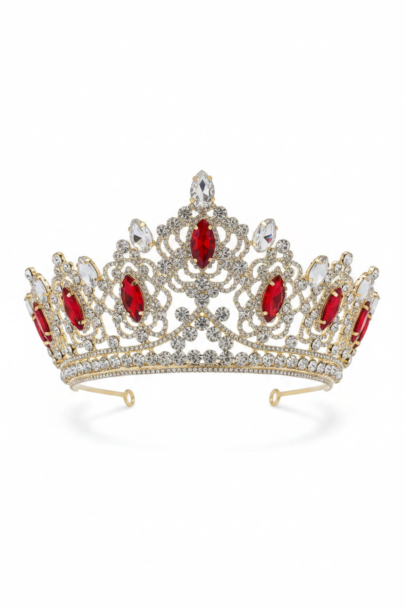 Silver tiara with red gemstones on a light gray background
